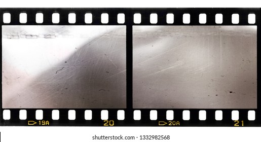 scratched 35mm film strip with two blank or empty frames
