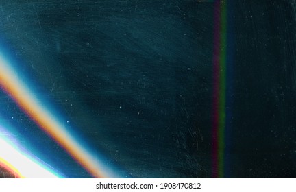 Scratched background. Lens flare effect. Blue distressed aged faded grunge surface with smeared stains dust noise colorful light design. - Shutterstock ID 1908470812