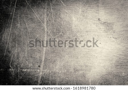 Scratched dirty dusty copper plate texture, old metal background. Cloudy and scratchy brass. Black and white image.