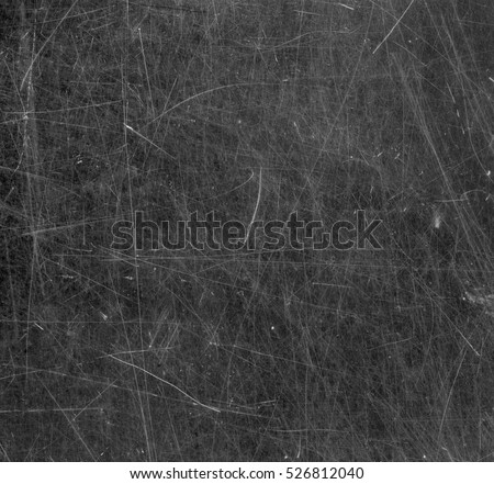 Scratched glass surface. Black and white.