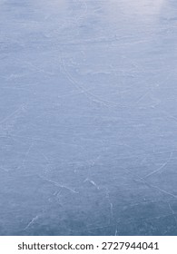 Scratched ice background, close of surface of ice hockey outdoor stadium. Scating arena.