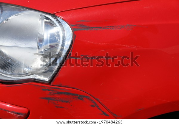 the scratched paint on a car panel after\
a collision, Alicante province,\
Spain