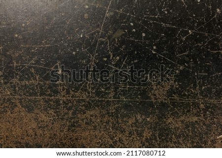 Scratched rusted and worn steel table top 