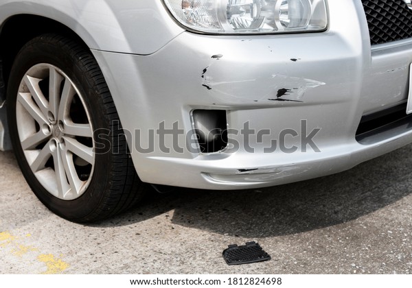 Scratches or dents on the car bumper. Car\
accident. Car\
insurance.