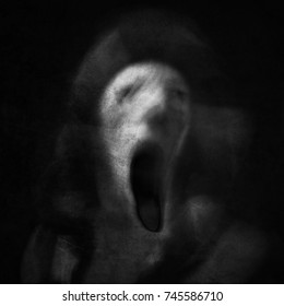 Scream of horror. Screaming ghost face. Scary Halloween mask. Surreal portrait. Black and white photo. Shot with long exposure.
 - Shutterstock ID 745586710