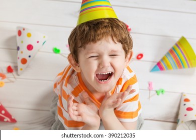 Screaming child in birthday party, cute boy crying.