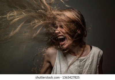 Screaming crazy frustrated woman dispersing into million particles, anxiety, anger and depression concept
