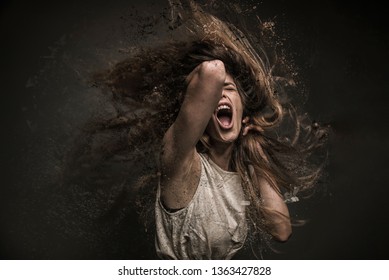 Screaming crazy frustrated woman dispersing into million particles, anxiety, anger and depression concept