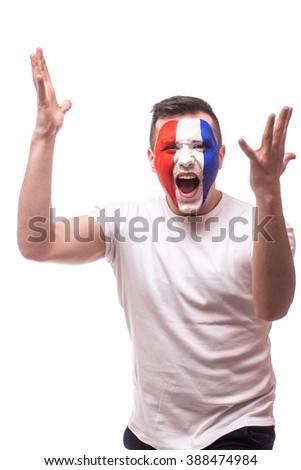 Screaming France football fan of disturbance game  of France national  team.  Big smile, scream, Hands over head. European  football fans concept.