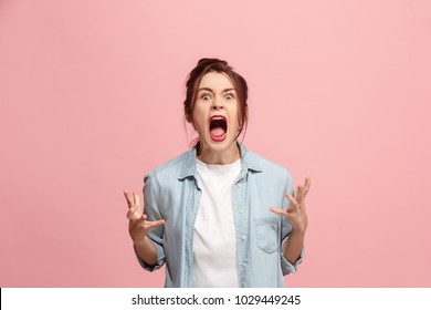 Screaming, Hate, Rage. Crying Emotional Angry Woman Screaming On Pink Studio Background. Emotional, Young Face. Female Half-length Portrait. Human Emotions, Facial Expression Concept. Trendy Colors