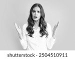 Screaming hate rage woman face. Emotional angry woman screaming on studio isolated background. Human emotions, expressive facial expressions. Panic and scream.