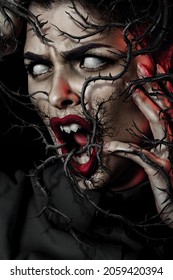 Screaming Horrible Woman With White Eyes, Red Lips And Sharp Teeth. Dark Curly Branches With Sharp Thorns Around Head