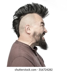 Screaming man with a mohawk and beard, isolated