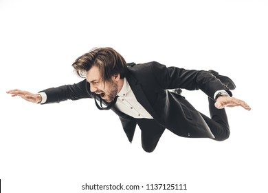 screaming young businessman in suit falling isolated on white