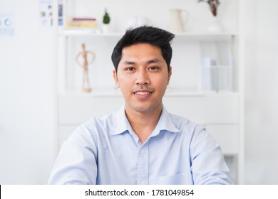 Screen Of Asian Businessman Talking While Video Call Or Virtual Meeting In Office, Front View Look At Laptop Web Camera