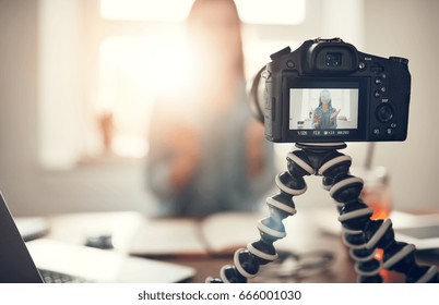 Screen Of Camera Recording A Young Female Blogger Gesturing While Making A Video.