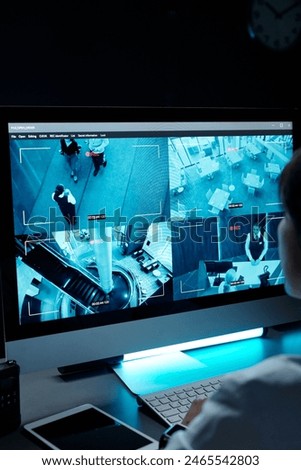 Screen of computer with cctv video system standing on workplace of security guard or officer working in surveillance room