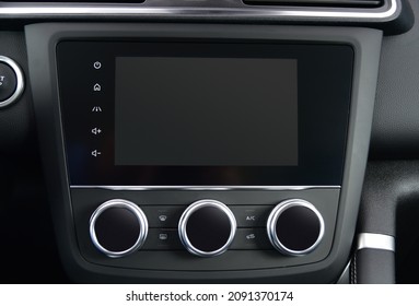 Screen multimedia system on dashboard in a modern car - Shutterstock ID 2091370174