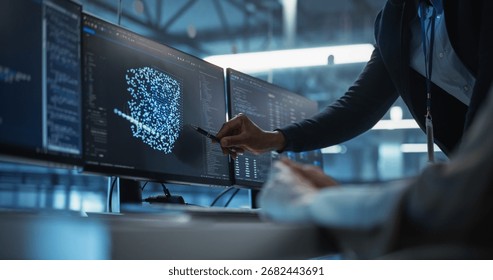 With Screen Setup Showing AI Code and Model Visualization, Female Developer Works Closely with a Black Team Leader Standing Beside Her, Discussing Improvements and Refinements to Their AI System