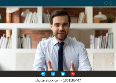 Screen view portrait of Caucasian businessman have webcam virtual conference with colleagues, engaged in online meeting or briefing. Male employee or boss talk speak on video call at home office.
