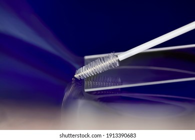 Screening For Cervical Cancer.  Brush To Collect Samples Of Cervical Cells To Detect Cell Abnormalities On Specimen Slide On Blue Background