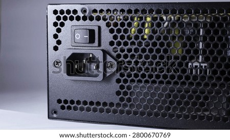 A screenshot of a computer power supply unit against a gray background. 