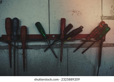 Screw drivers hanging on the wall