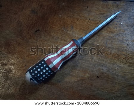 Screwdriver with American flag on  memorial day, Screwdriver with American flag on traditional wooden plate