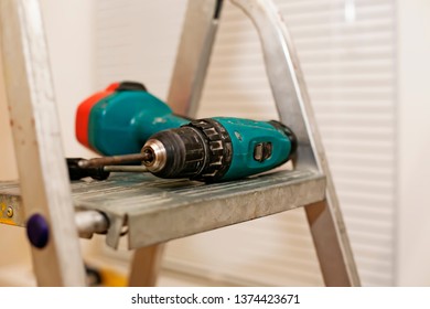 Screwdriver – handyman equipment for hanging home décor, assembling furniture and installing household items either repair, renovation and remodeling. Cordless tool as mounting service appurtenance
 - Shutterstock ID 1374423671