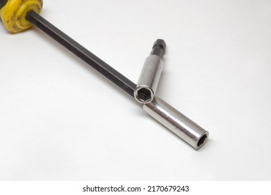 screwdriver head for interchangeable bits and hex shank extension bar, chromed bits holder, closeup