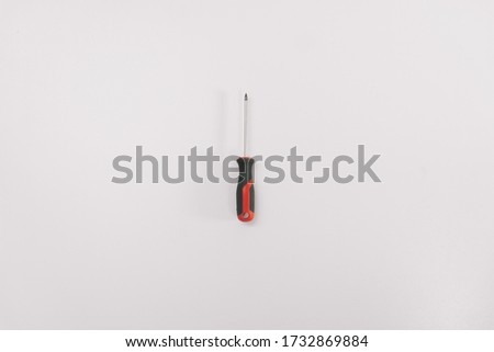 Screwdriver on a white background isolation. Copy space on top. Construction Tools Sale Concept.