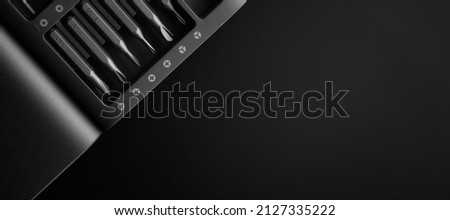 Screwdriver tips different shapes and sizes close up. Manual metal mini screwdriver and set of the interchangeable bits. Precision Screwdriver Kit. Steel Magnetic Bits. home appliance repair kit