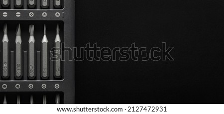 Screwdriver tips different shapes and sizes close up. Manual metal mini screwdriver and set of the interchangeable bits. Precision Screwdriver Kit. Steel Magnetic Bits. home appliance repair kit