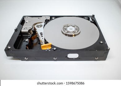 A Screwed-on Hard Disk Shows The Inner Workings Of A Hard Disk