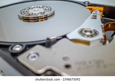 A Screwed-on Hard Disk Shows The Inner Workings Of A Hard Disk