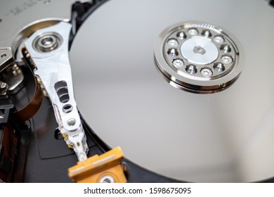 A Screwed-on Hard Disk Shows The Inner Workings Of A Hard Disk