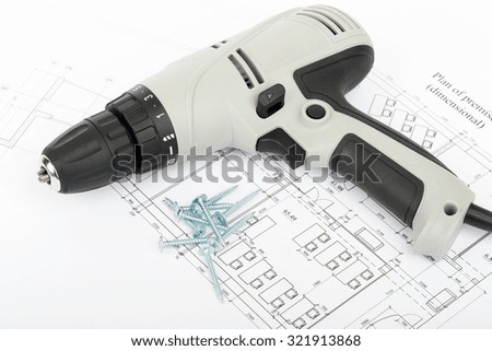 Screwer on draft with screws, close up view