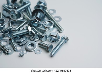 Screws bolts threads steel washers nails grommet machine parts isolated at white                               