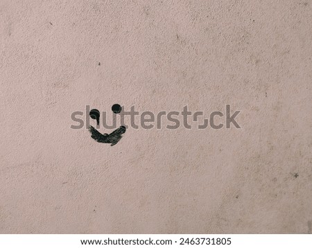 Scribble face shape on white wall.