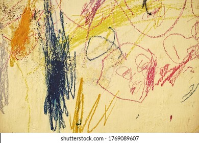 scribble on a wall by a child.  Photos of abstract images on the wall