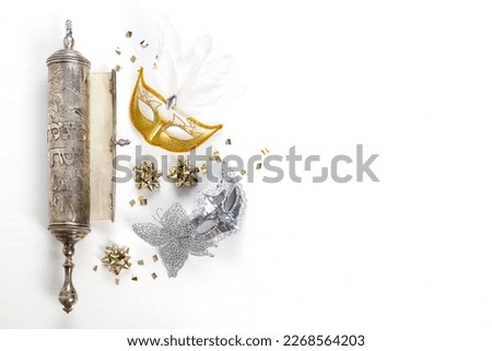 The Scroll of Esther (With an inscription in Hebrew 'Book of Esther') and Purim Festival objects. On white background. Top view Foto stock © 