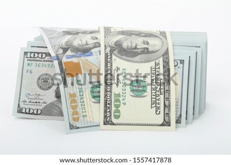 Scrolled stack of 100 dollar stock photo