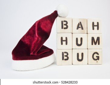 Scrooge Grinch Christmas Greeting 'Bah Humbug' In Blocks With Seasonal Santa Hat. Horizontal.