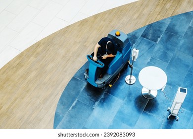 Scrubber dryer-dryer in a commercial building. Washing floors in a large room with a marble surface. Top down view. - Powered by Shutterstock