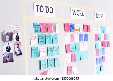 Scrum task board with stickers on wall in office - Shutterstock ID 1350869855