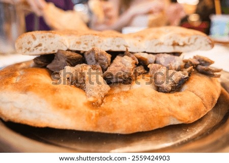 A Scrumptious Plate of MeatStuffed Flatbread Ready to Be Enjoyed