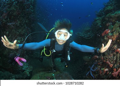 Scuba Dive. Young Asian Woman Scuba Diving