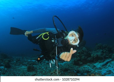 Scuba Dive. Young Asian Woman Scuba Diving