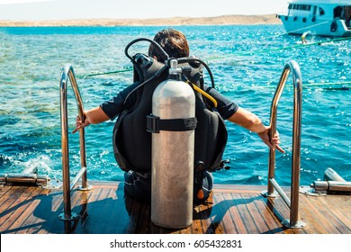 Scuba diver before diving. A diving lesson in open water.