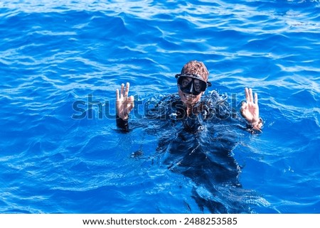 Scuba diver before diving. A diving lesson in open water.